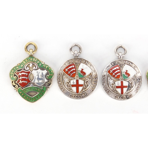2663 - Four silver and enamel cycling jewels relating to S D Howkins, the largest 4cm high, 40.7g