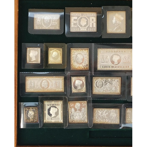 2698 - Stamps of Royalty, twenty five solid silver stamp replicas, housed in a fitted display case