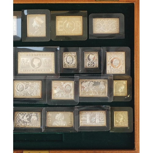 2698 - Stamps of Royalty, twenty five solid silver stamp replicas, housed in a fitted display case