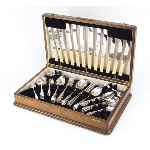 2125 - 1930's oak six place canteen of Sheffield silver plated cutlery, 46cm wide