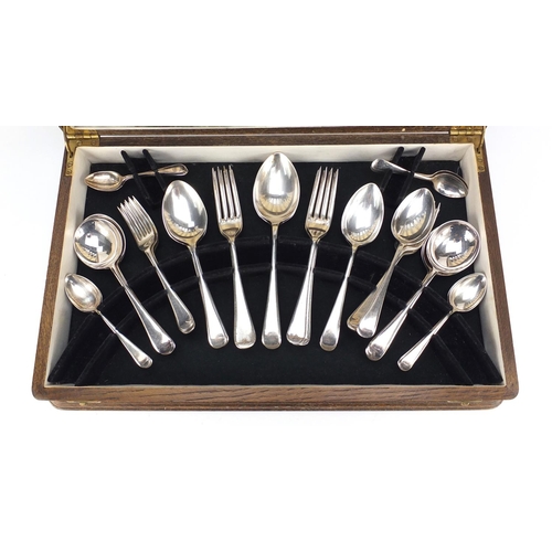 2125 - 1930's oak six place canteen of Sheffield silver plated cutlery, 46cm wide
