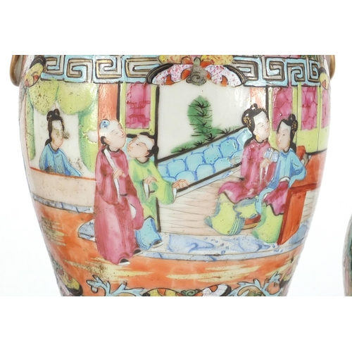 419 - Three Chinese Canton porcelain vases comprising a pair and a larger example with elephant head ring ... 