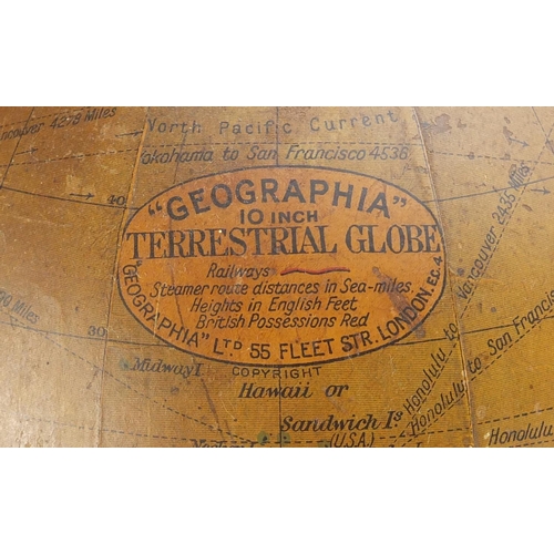 26 - Geographia 10 inch terrestrial globe raised on an ebonised stand, 48cm high