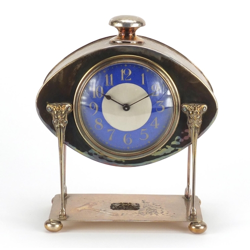 854 - Arts & Crafts copper mantel clock with enamelled dial and Arabic numerals, 20cm high