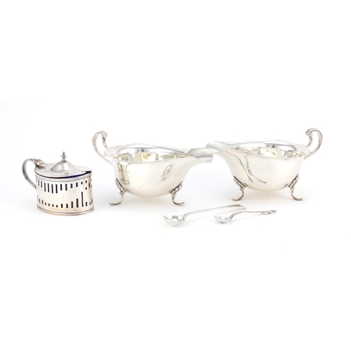 941 - Silver items including a pair of three footed sauce boats by Mappin & Webb and a mustard with blue g... 