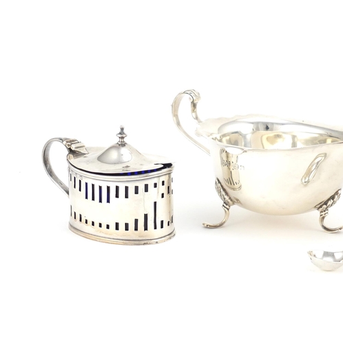 941 - Silver items including a pair of three footed sauce boats by Mappin & Webb and a mustard with blue g... 