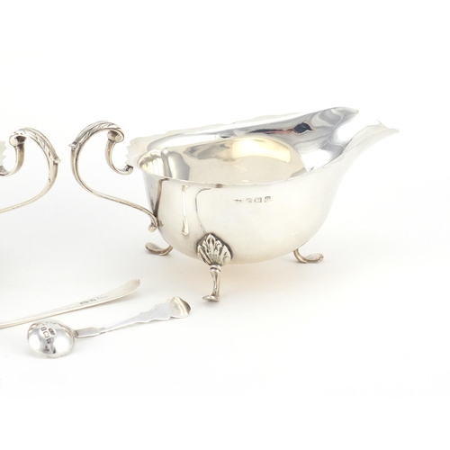 941 - Silver items including a pair of three footed sauce boats by Mappin & Webb and a mustard with blue g... 