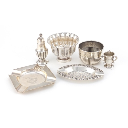 947 - Silver items including two circular bowls, a miniature tig trophy and two ashtrays, various hallmark... 