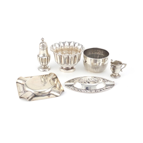 947 - Silver items including two circular bowls, a miniature tig trophy and two ashtrays, various hallmark... 