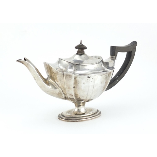 867 - Victorian silver teapot with fluted body and ebonised handle and knop, indistinct maker mark London ... 
