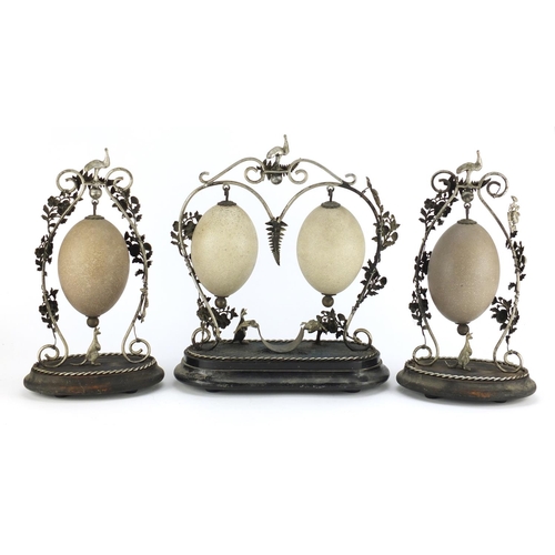 23 - ** WITHDRAWN FROM SALE ** Australian emu egg garniture with silver coloured metal mounts, the eggs c... 