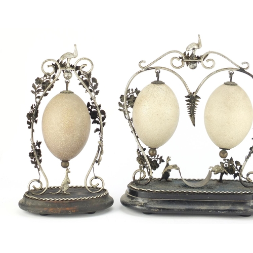 23 - ** WITHDRAWN FROM SALE ** Australian emu egg garniture with silver coloured metal mounts, the eggs c... 