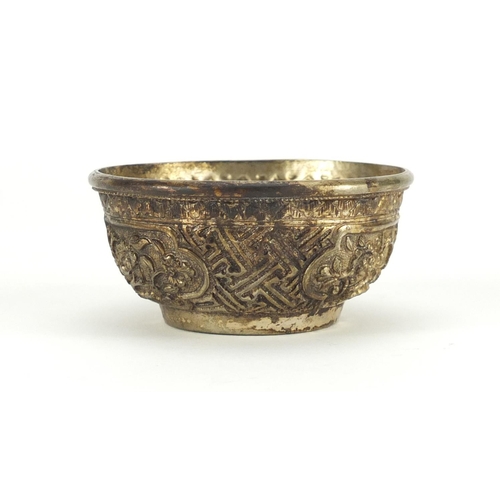 694 - 18th/19th century Sino-Tibetan silver coloured metal bowl, finely decorated with panels of flowers, ... 
