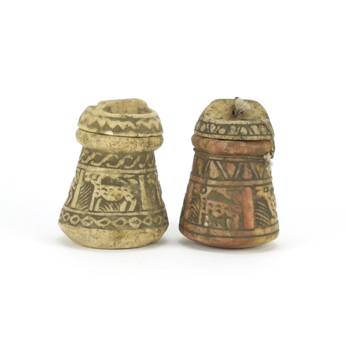 711 - Two Islamic stone pots with covers carved with animals, the largest 11cm high