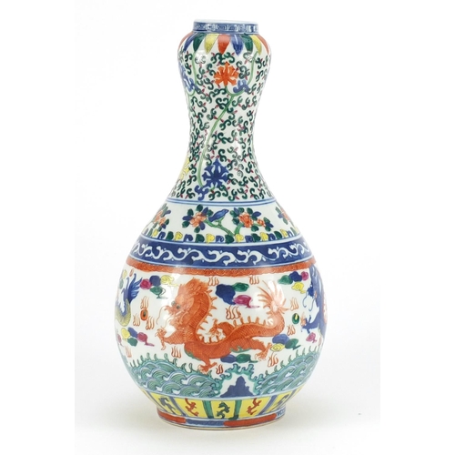 428 - Chinese porcelain Doucai garlic neck vase, hand painted with dragons chasing the flaming pearl among... 