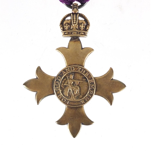 291 - Silver gilt OBE housed in a fitted silk and velvet lined leather case