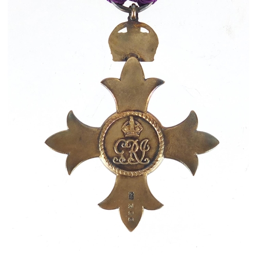 291 - Silver gilt OBE housed in a fitted silk and velvet lined leather case