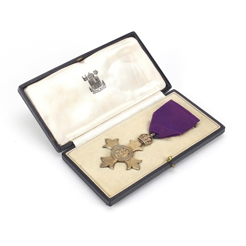 291 - Silver gilt OBE housed in a fitted silk and velvet lined leather case