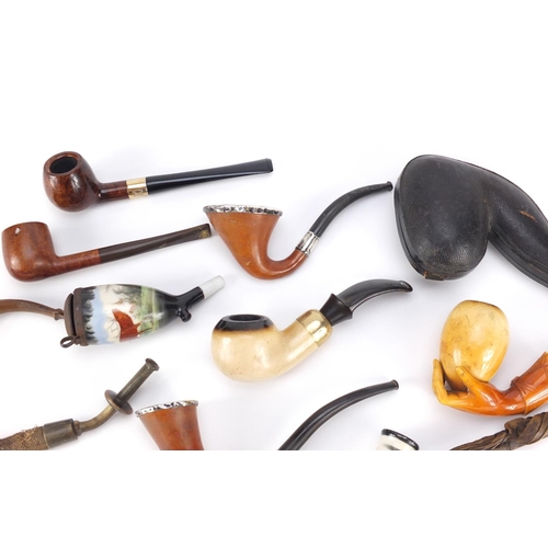 91 - Antique and later pipes, some silver mounted including a Meerschaum bowl in the form of a hand house... 