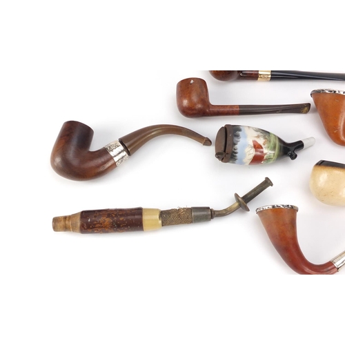 91 - Antique and later pipes, some silver mounted including a Meerschaum bowl in the form of a hand house... 