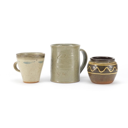 842 - Studio pottery comprising a John Leach Studio Pottery Bovey Tracy mug, Leach pottery mug and a Sydne... 