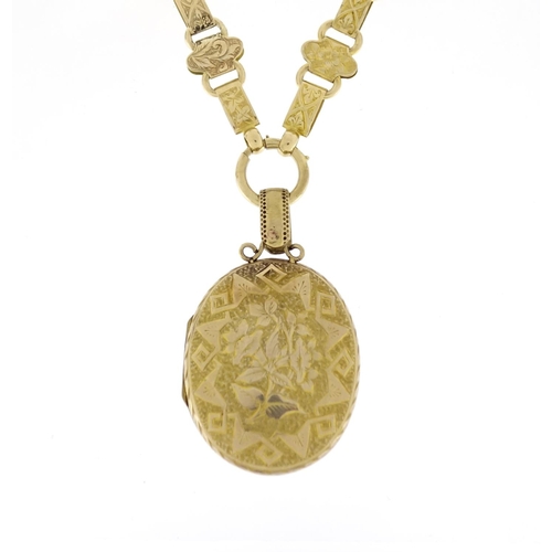 972 - Victorian aesthetic unmarked gold locket on a matching 9ct gold necklace, the locket 6.5cm in length... 