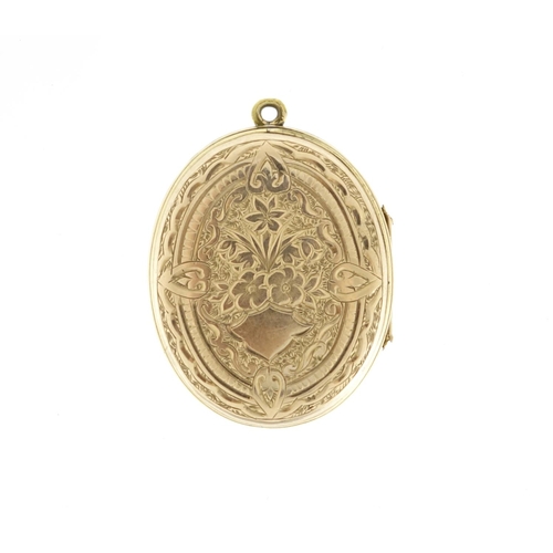 985 - Victorian unmarked gold locket enamelled with white and blue flowers, 3.5cm high, 10.0g