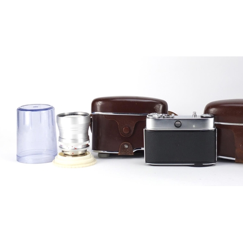 96 - Cameras and accessories including a Voigtlander Zoomar lens and Kodak Retina Reflex