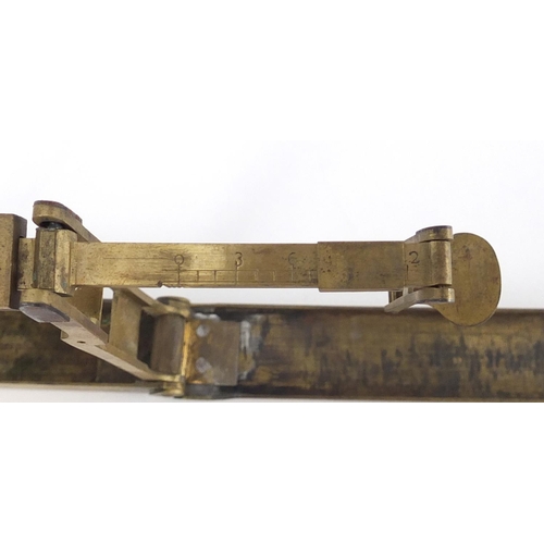 61 - Two sets of antique brass sovereign scales, the largest 12.5cm in length when closed