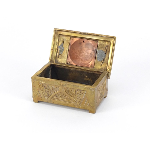 852 - Arts & Crafts brass casket with hinged lid having an enamel panel, 4cm H x 8cm W x 5cm D