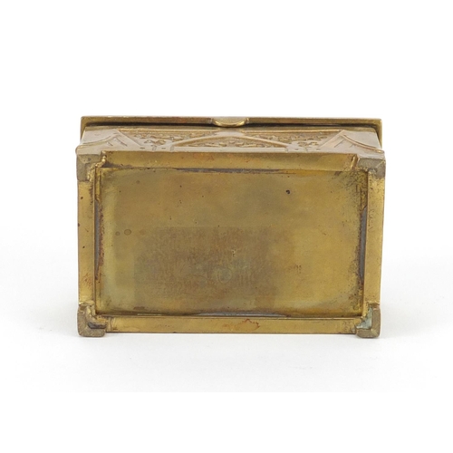 852 - Arts & Crafts brass casket with hinged lid having an enamel panel, 4cm H x 8cm W x 5cm D