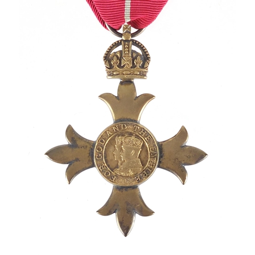 292 - Silver gilt OBE housed in a fitted silk and velvet lined leather case