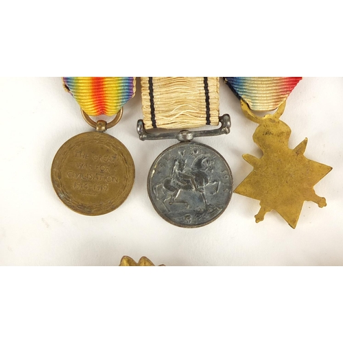 285 - British Military World War I trio with dress medals, dog tags, badges and pips, the trio awarded to ... 