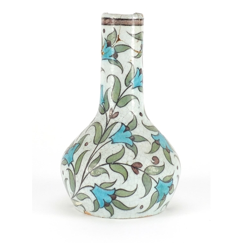 718 - Iznik pottery vase hand painted with stylised flowers, 17cm high