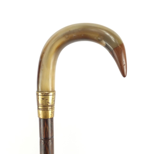 148 - Horn handled walking stick with brass collar, possibly rhinoceros horn, 88cm in length