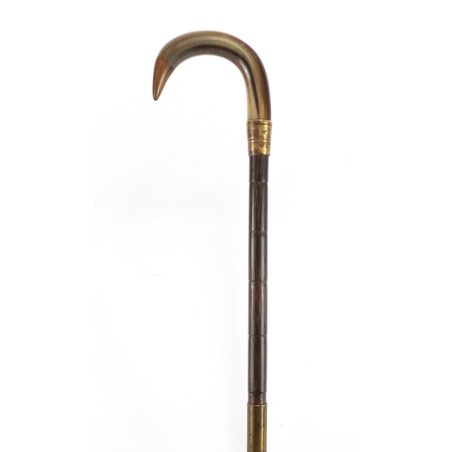 148 - Horn handled walking stick with brass collar, possibly rhinoceros horn, 88cm in length