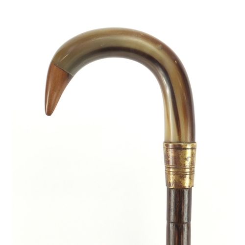 148 - Horn handled walking stick with brass collar, possibly rhinoceros horn, 88cm in length