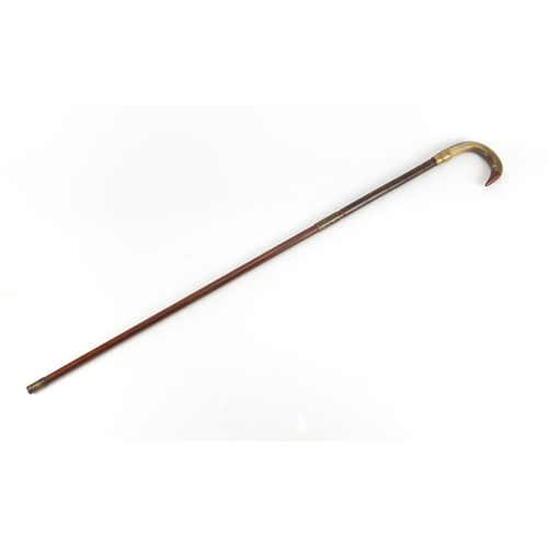 148 - Horn handled walking stick with brass collar, possibly rhinoceros horn, 88cm in length