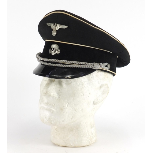 313 - German Military interest visor cap with badges