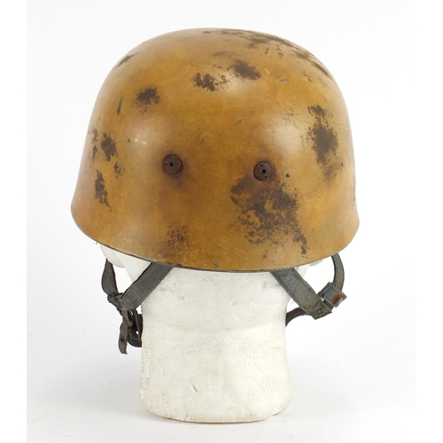 303 - German Military interest tin helmet with decals and leather liner, stamps to the interior