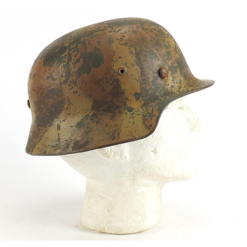 301 - German Military interest tin helmet with leather liner, impressed marks to the interior