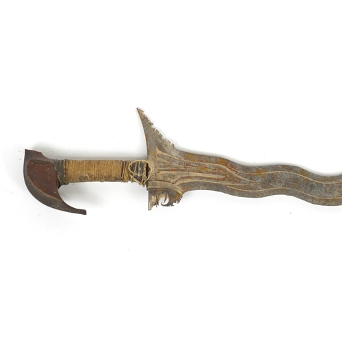 335 - Philippines silver mounted Moro Kris with steel blade, 65cm in length