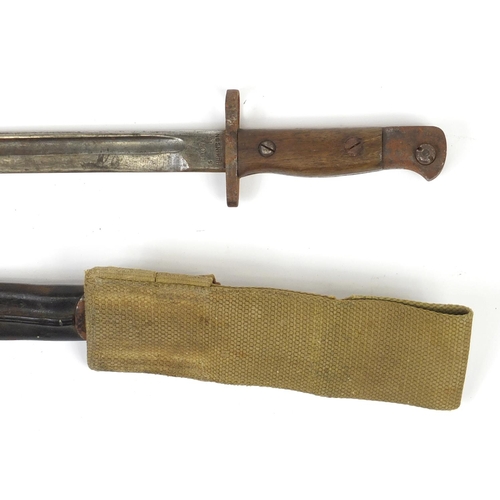 324 - British Military 1907 pattern bayonet with scabbard by Wilkinson, 57.5cm in length