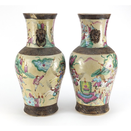 407 - Pair of Chinese crackle glazed vases with twin handles, each finely hand painted in the famille rose... 