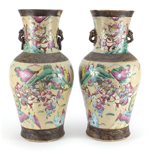 407 - Pair of Chinese crackle glazed vases with twin handles, each finely hand painted in the famille rose... 