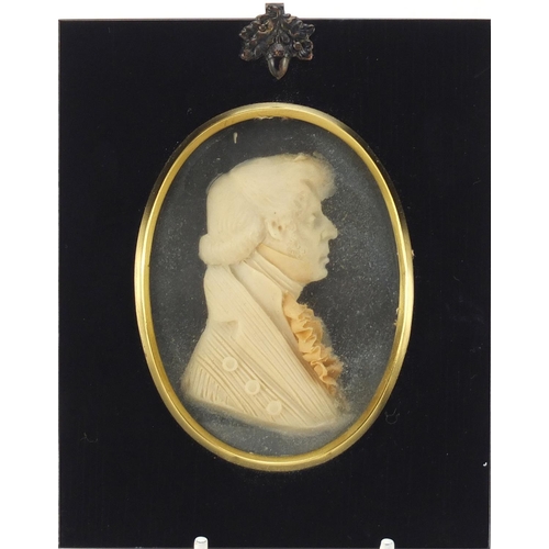 125 - Pair of Georgian style wax portrait miniatures by Leslie Ray, housed in ebonised frames, the miniatu... 