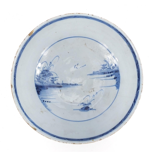 778 - 18th century English Delft bowl, hand painted in the Chinese manner with landscapes, 22.5cm in diame... 