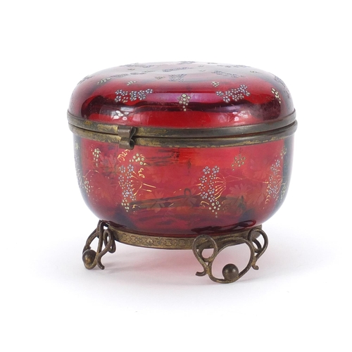 802 - Continental ruby glass bomboniere with metal mounts, enamelled with flowers, 11.5cm high