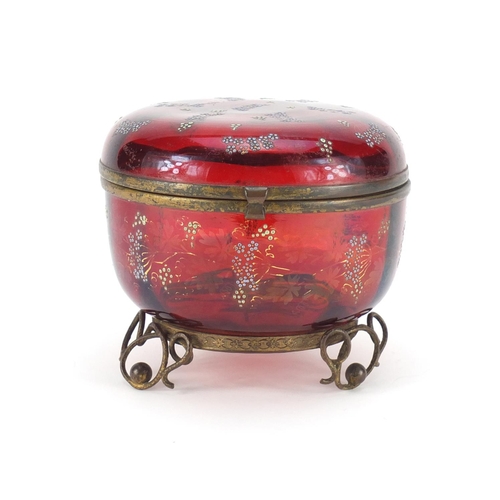 802 - Continental ruby glass bomboniere with metal mounts, enamelled with flowers, 11.5cm high