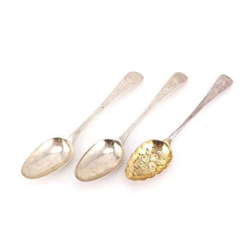 955 - Two Georgian silver tablespoons and a berry spoon, various London hallmarks, the largest 21cm in len... 